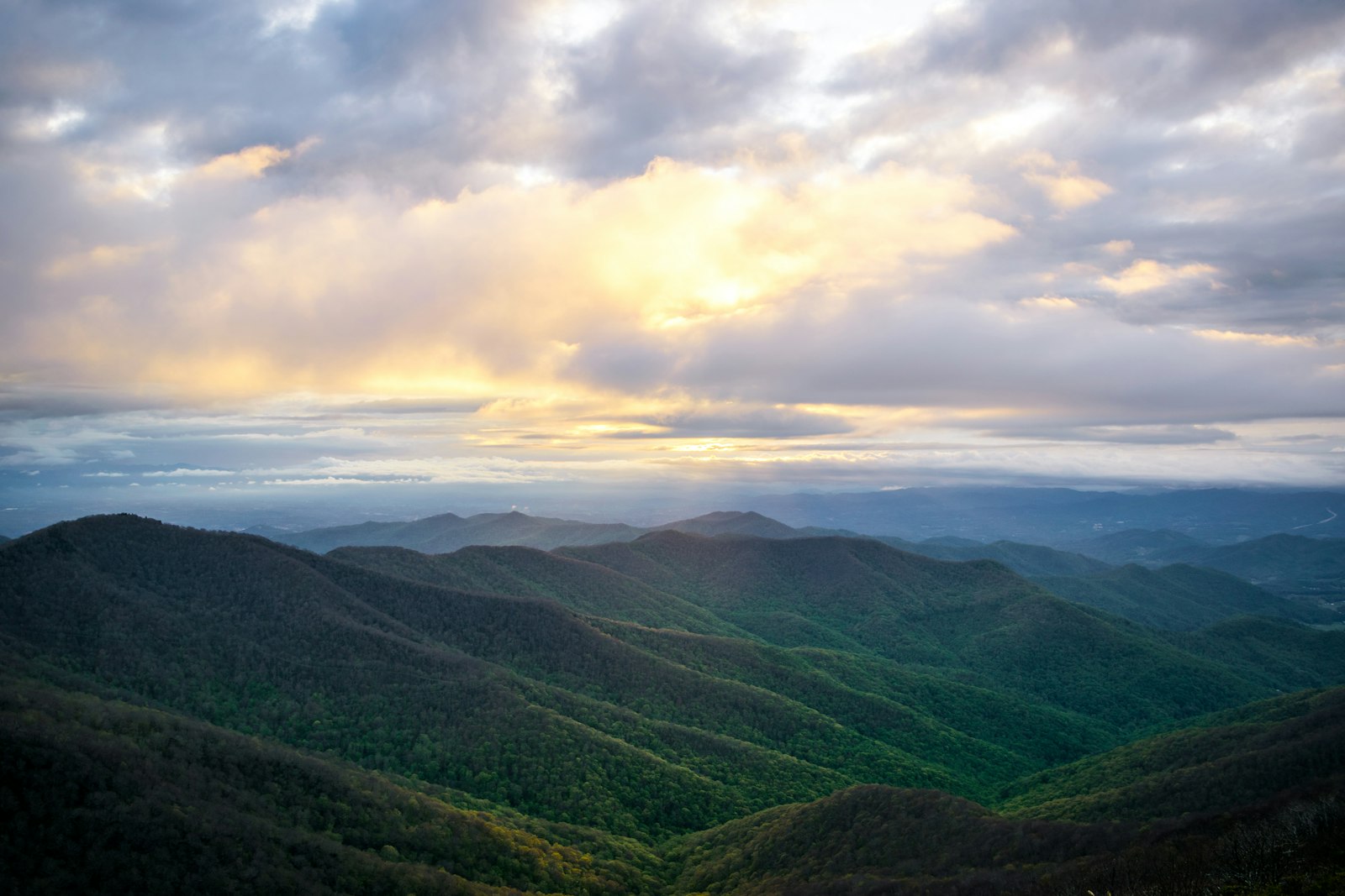 Rolling Appalachian ridge under cloud-broken sunlight